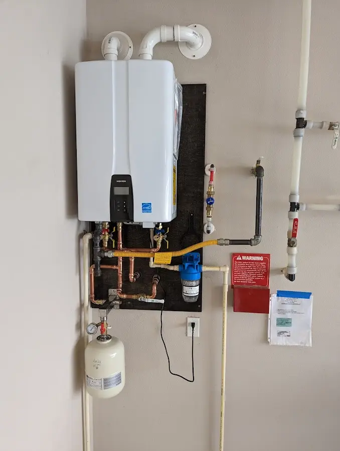 Professional plumber installing copper piping in a Kingsville home